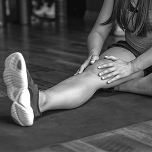 A woman suffering from a sports injury